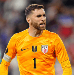 Football goalkeeper diving for a save
